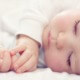 Beautiful sleeping baby conceived with surrogacy