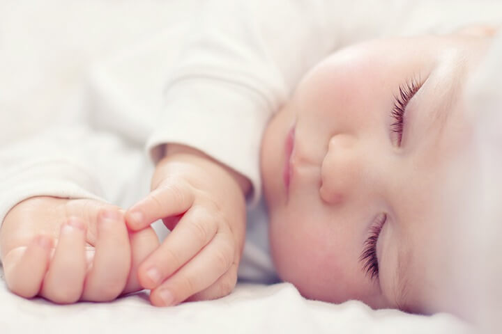 Beautiful sleeping baby conceived with surrogacy